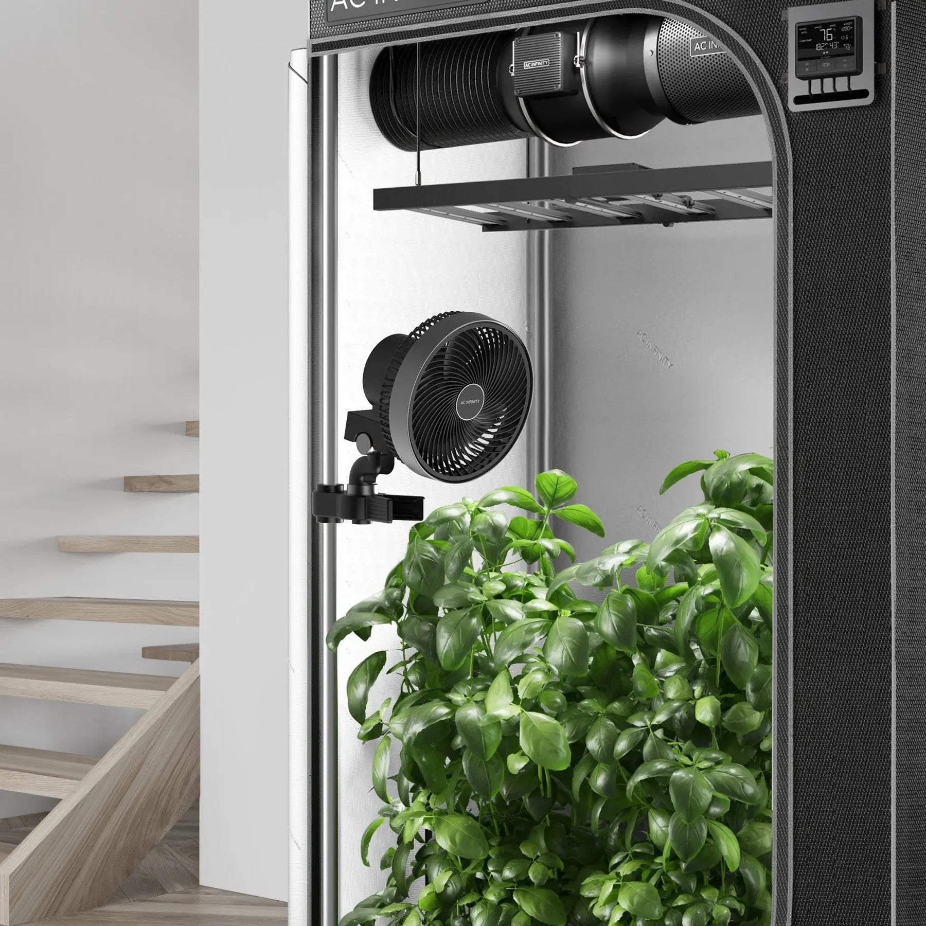 Gardening system with plants inside a cabinet, featuring ACDC brand on fans.